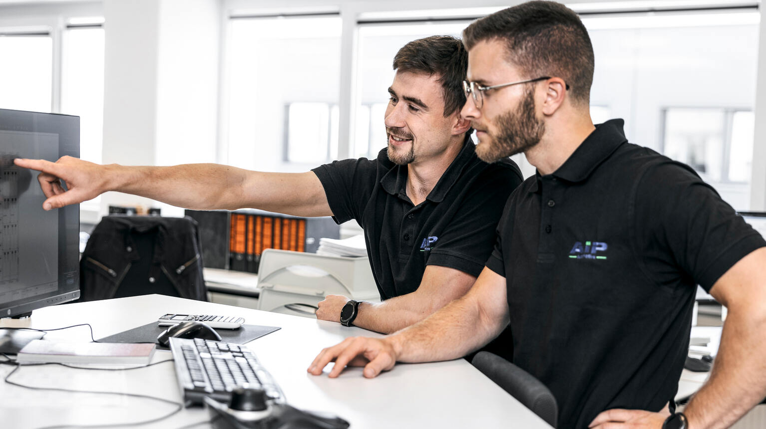 Team reviewing on-screen