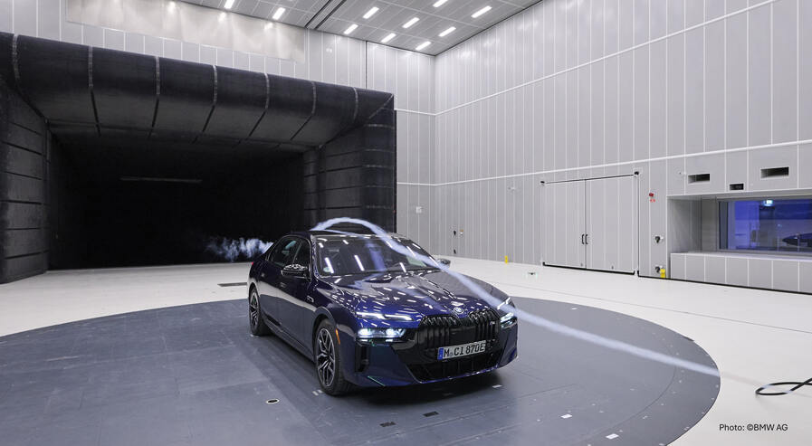 Vehicle on turntable surrounded by airflow